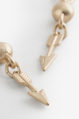 Close-up of the arrows on the Gold Arrow Earrings.