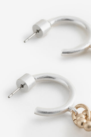 Close-up of the hoops on the Gold Arrow Earrings.