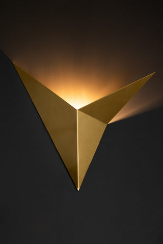 Lifestyle image of the Gold Arrow Metal Wall Light.