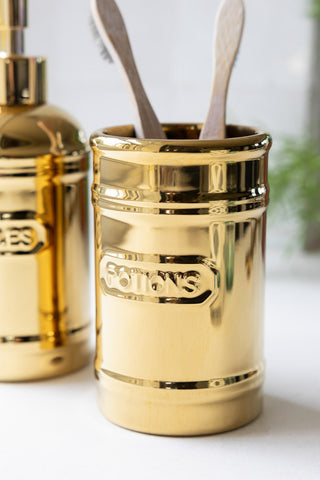 The Potions Bathroom Cup shown with bamboo toothbrushes. 