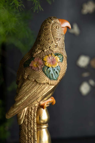 Close-up image of the Gloria Gold Bird Ornament