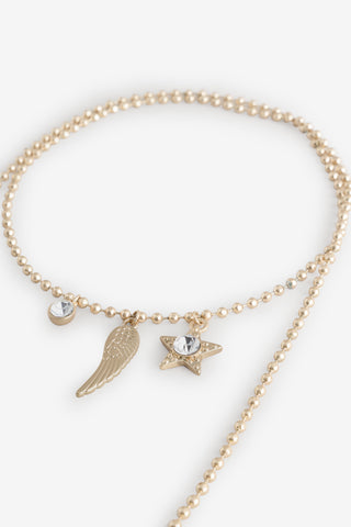 Close-up of the Gold Charm Wraparound Necklace on a white background.