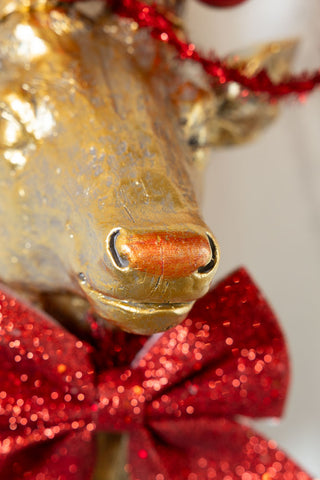 Close-up of the red nose of the Gold Christmas Reindeer Wall Art Decoration.