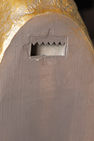 Close-up of the fixing on the reverse side of the Gold Christmas Reindeer Wall Art Decoration.