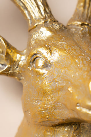 Close-up of the eye of the Gold Christmas Reindeer Wall Art Decoration.
