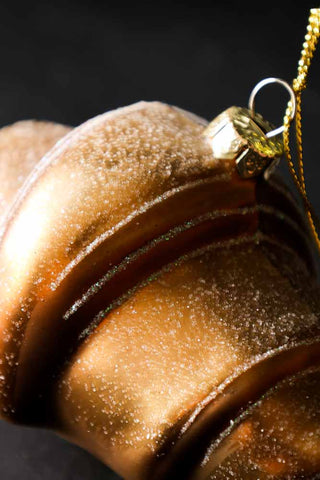 Close-up image of the Gold Croissant Glass Christmas Decoration