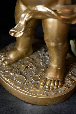 Close-up of the base of the Gold Cupid Table Lamp.