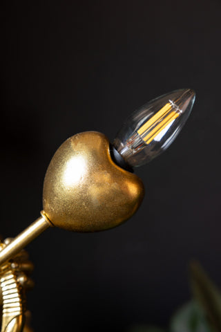 Close-up of the heart of the Gold Cupid Table Lamp, with a bulb.