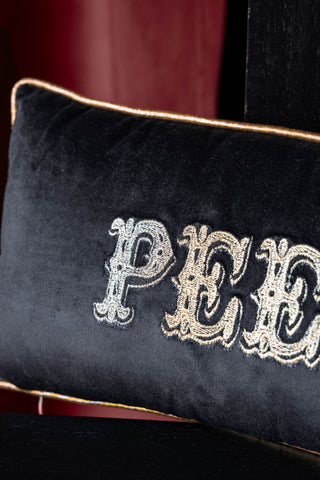 Close-up image of the Gold Embroidered Peep Show Cushion