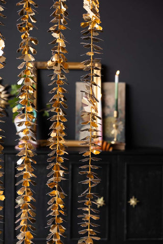 Image of the Gold Flower Garland Christmas Decoration hanging up