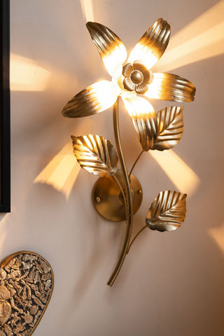 Lifestyle image of the Gold Flower Wall Light