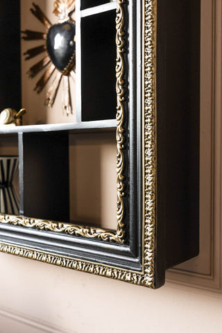 Close-up of the corner of the Ornate Black & Gold Framed Wall Shelf.