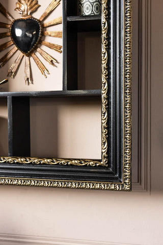 Detail shot of the corner of the Ornate Black & Gold Framed Wall Shelf.