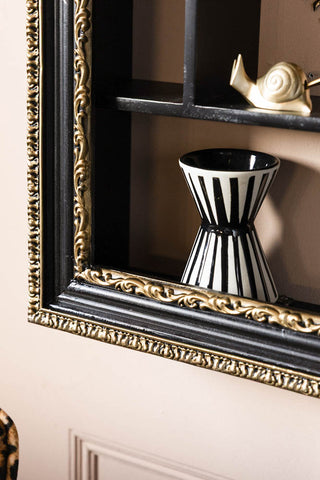 Close-up of the bottom left-hand corner of the Ornate Black & Gold Framed Wall Shelf.