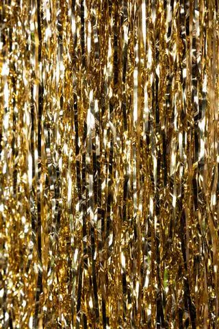 Detail image showing a close-up of the tinsel fringe on the Gold Tinsel Fringe Chandelier Decoration. 