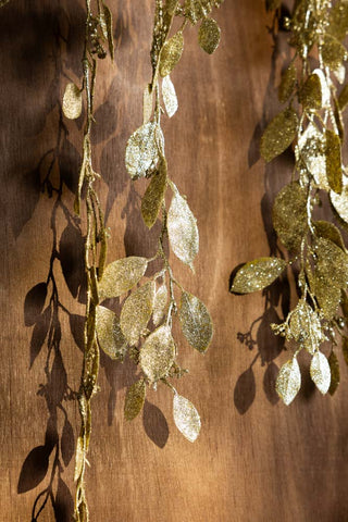 Close-up of the Gold Glitter Eucalyptus Leaf Christmas Garland.