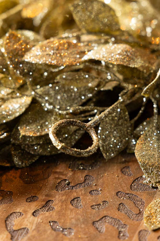 Close-up of the hanging loop on the end of the Gold Glitter Eucalyptus Leaf Christmas Garland.