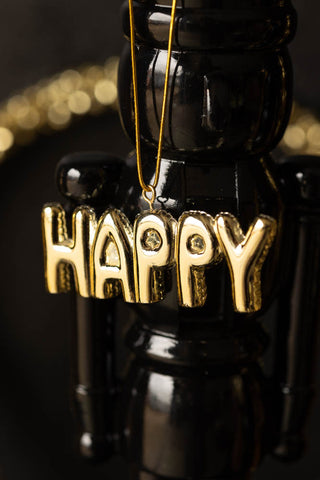 Lifestyle image of the Gold Happy Christmas Decoration