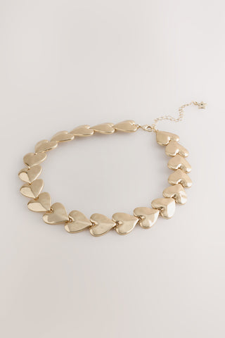 The Gold Heart Necklace on a white background.