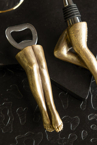The Gold Legs Bottle Opener and stopper in the background. 