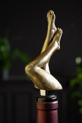 The Gold Legs Bottle Stopper shown in a wine bottle. 