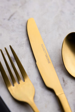 Detail of the gold finish on the Gold Leopard 16 Piece Cutlery Set. 