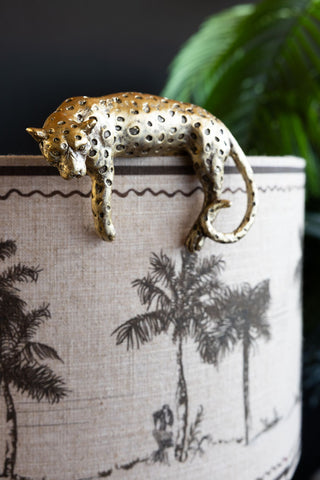 Lifestyle image of the Gold Lounging Leopard Decoration