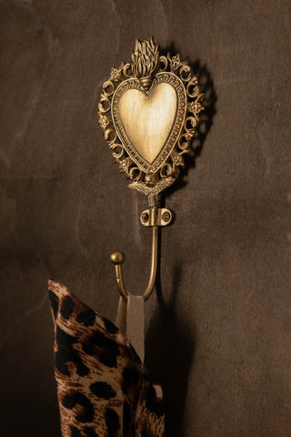 Lifestyle image of the Gold Milagro Heart Wall Hook