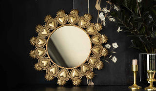 Gold milagro round mirror.