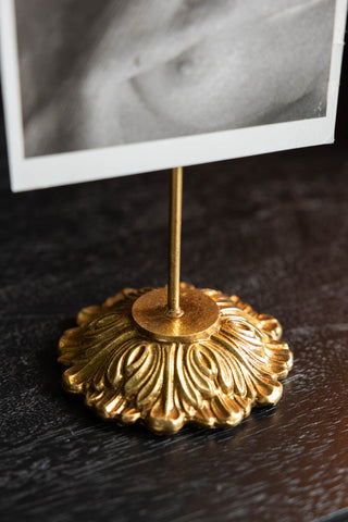 The ornate gold stand of the Gold Milagro Heart Photo Stand. 