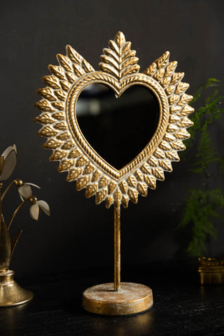 Lifestyle image of the Gold Milagro Heart Tabletop Mirror