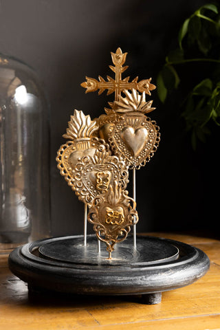 The Gold Milagro Hearts Glass Dome shown without the glass cloche. 