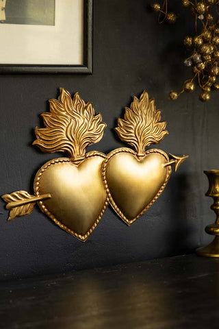 Lifestyle image of the Gold Milagro Lovers Hearts Ornament