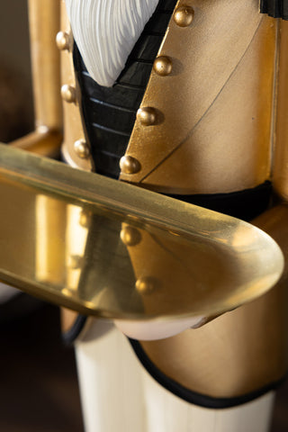 Close-up of the tray of the Gold Nutcracker Butler Christmas Decoration.