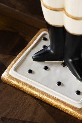 Close-up of the base of the Gold Nutcracker Butler Christmas Decoration.