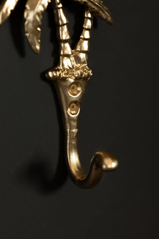 Close-up of the hook on the base of the Gold Palm Trees Wall Hook.