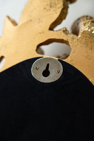 Image of the back of the Gold Parrot Mirror