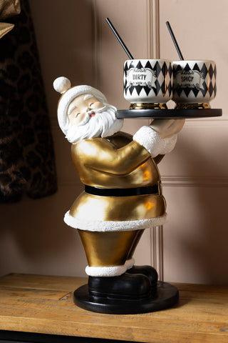 The Gold Santa Butler Christmas Decoration styled with two cocktail cups on.