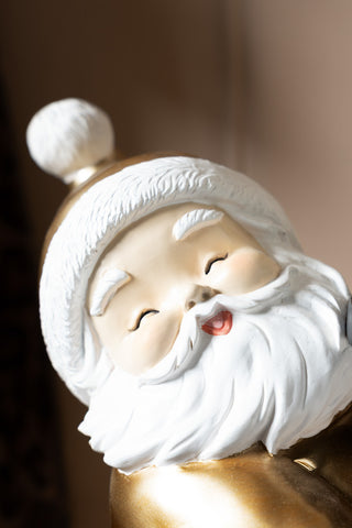 Close-up of the face of the Gold Santa Butler Christmas Decoration.