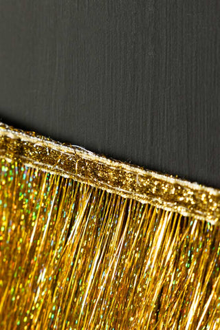 Close-up of the edge of the Gold Scalloped Tinsel Garland.