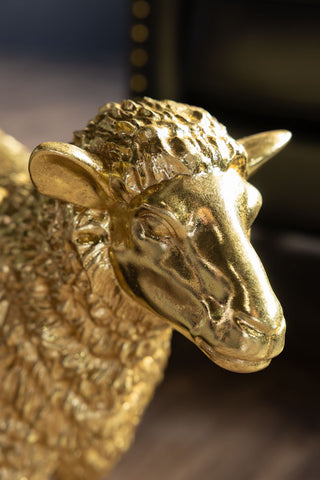 Close-up of the face of the Gold Sheep Decorative Ornament.