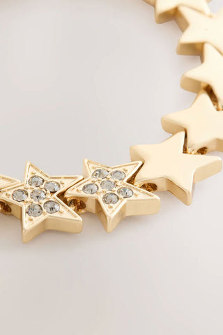 Close-up image of the Gold Star Bracelet on a white background