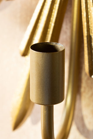 The candle holder of the Gold Star Candle Wall Sconce. 