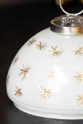 Close-up of the star design on the Gold Star Christmas Candle Bauble Ornament.