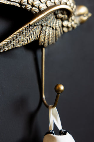 Close-up image of the Gold Swallow Coat Hook
