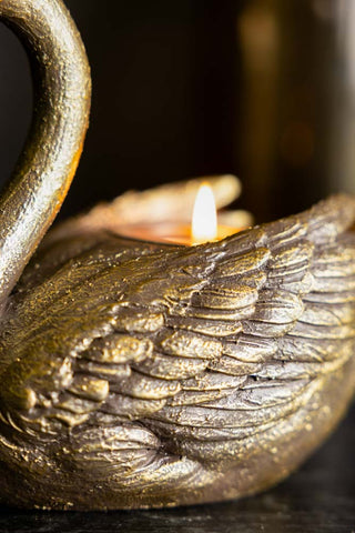 The side wing detail on the Gold Swan Tealight Holder. 