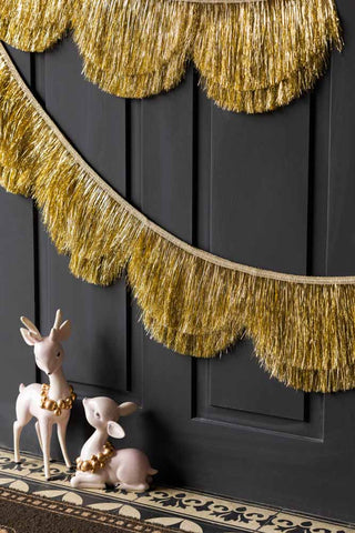 Lifestyle image of the Gold Tinsel Scalloped Decorative Garland