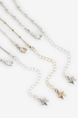 Close-up of the clasps on the Gold & Silver Charm Layered Necklace.