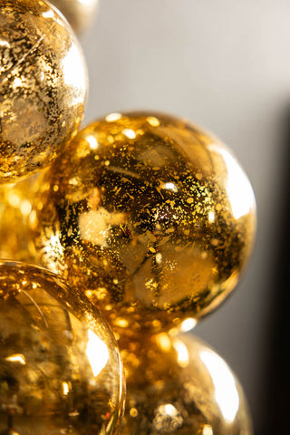 Close-up of the surface of the Gold Antique-Effect Bauble Christmas Garland.