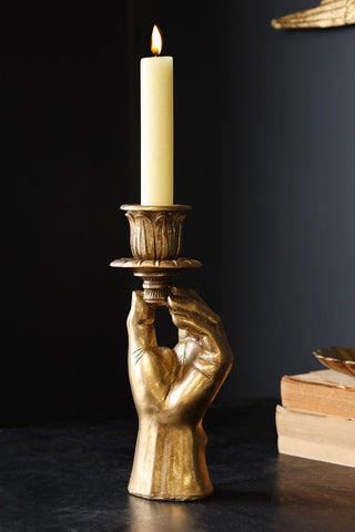 Lifestyle image of the Gold Hand Candlestick Holder